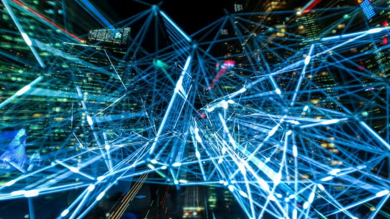 Abstract depiction of interconnected blue lines representing AI networks with a cityscape background.