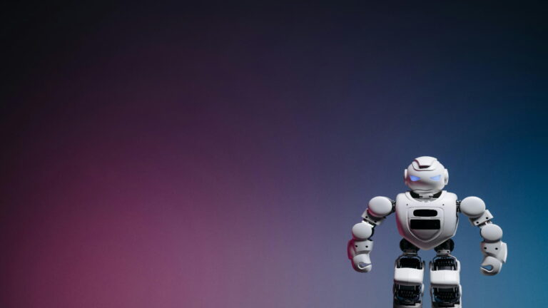 A humanoid robot standing against a gradient background