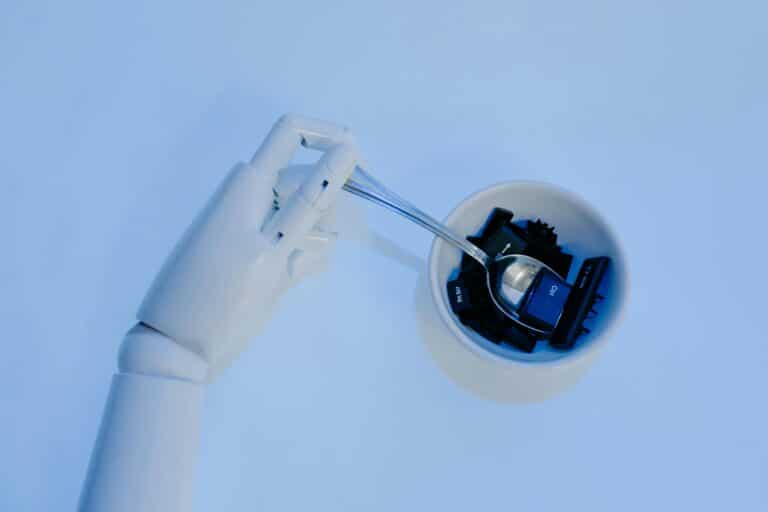 AI for Tax Consultants - robotic hand holding a spoon with keyboard keys in a bowl