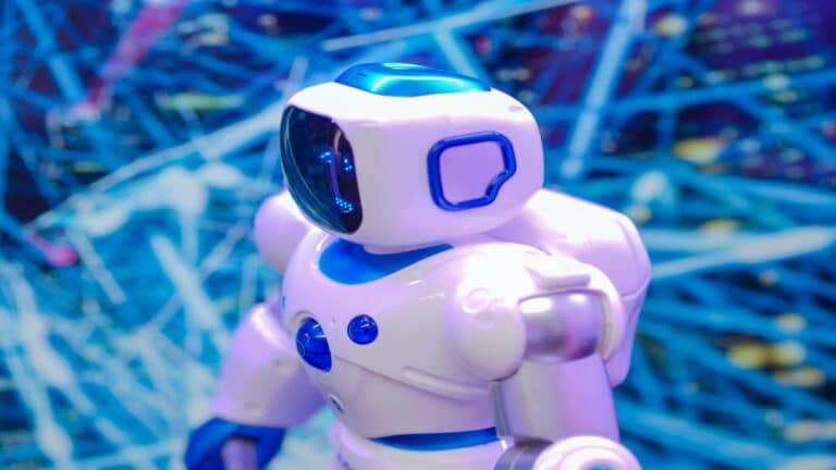 A white and blue robot with a digital background