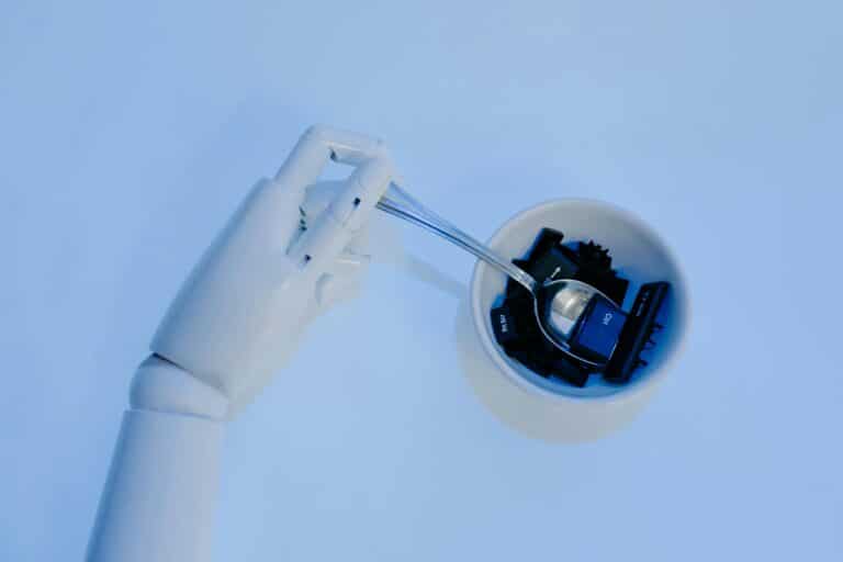 Conceptual image of AI in Corporate Training, featuring a robotic hand stirring a bowl of keyboard keys with a spoon, symbolizing the integration of artificial intelligence in learning.