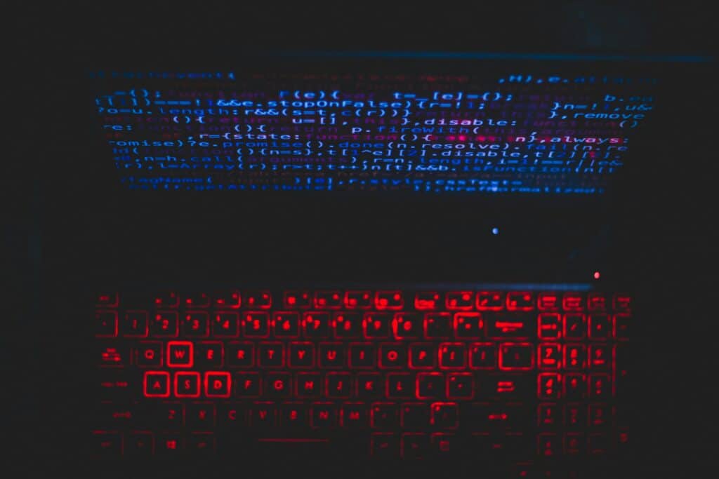 AI for Educational Therapy Services: Keyboard illuminated with code, symbolizing the integration of AI in enhancing therapy.